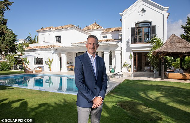 Sunny outlook: Jamie Buss, at a villa in Marbella, has more clients paying cash