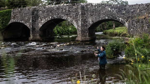 Danni Barry fishing for trout in the Slaney river. Photograph: Liosa McNamara