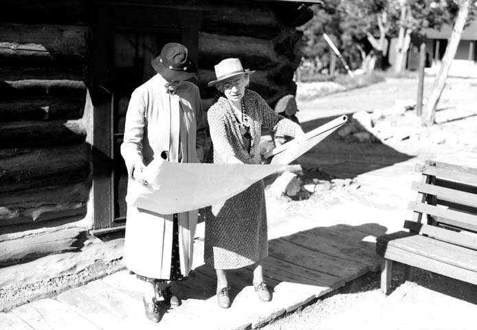 Mary Colter, right, showing a blueprint to the wife of the Secretary of the Interior, circa 1935.