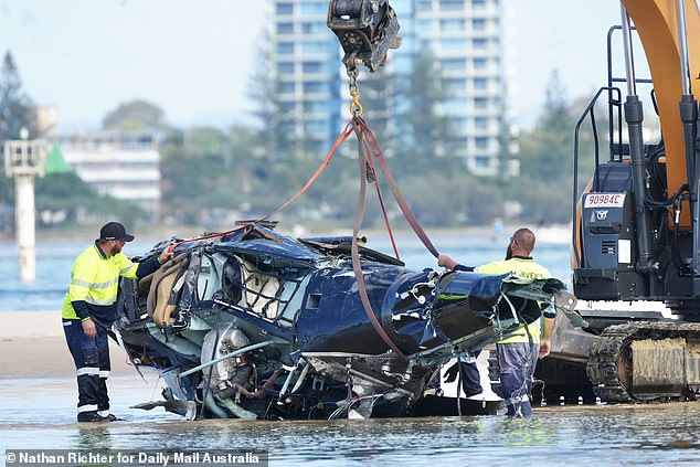 Ms Doktar said the crash (pictured, above, the main body of the destroyed helicopter tied up for towing) had taken away 'a well respected & well known Gold Coast Pilot, Son, Father, Partner & Friend'